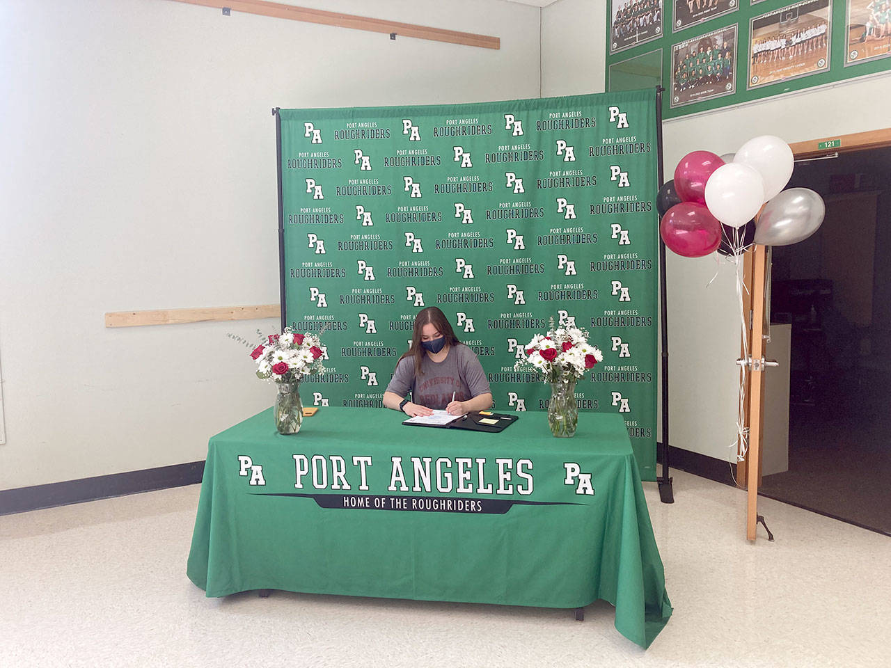 Port Angeles senior Katelyn Sheldon signs a letter of intent to compete for the University of Redlands track and field team. (Michael Carman/Peninsula Daily News)