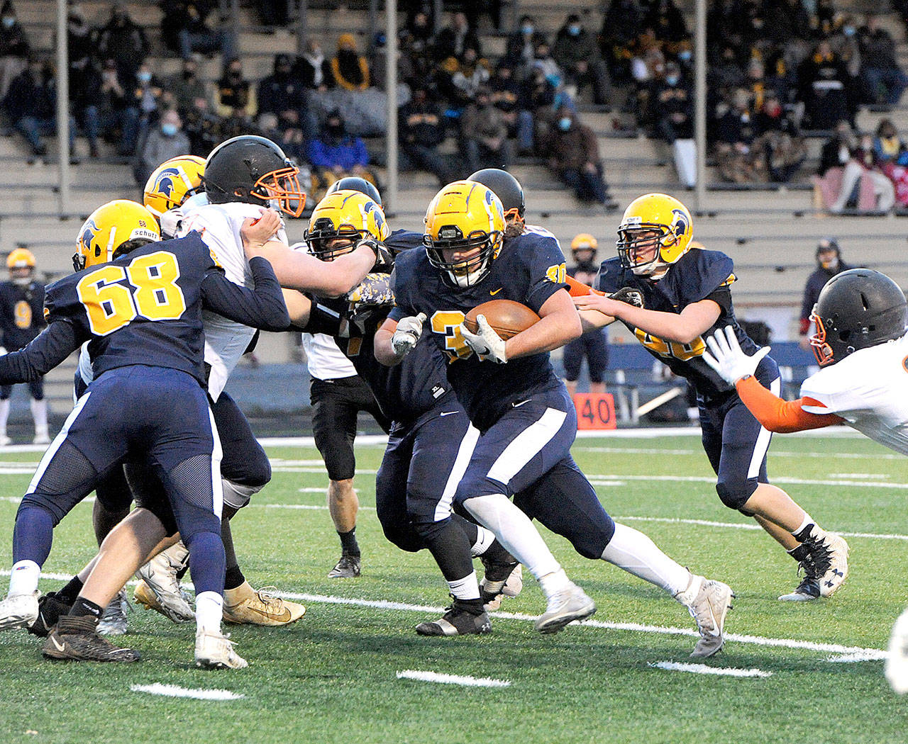 Spartan Hayden Baker (30) on his way to a touchdown against Napavine during the first quarter of play Friday evening on the turf at Spartan Stadium. Photo by Lonnie Archibald.