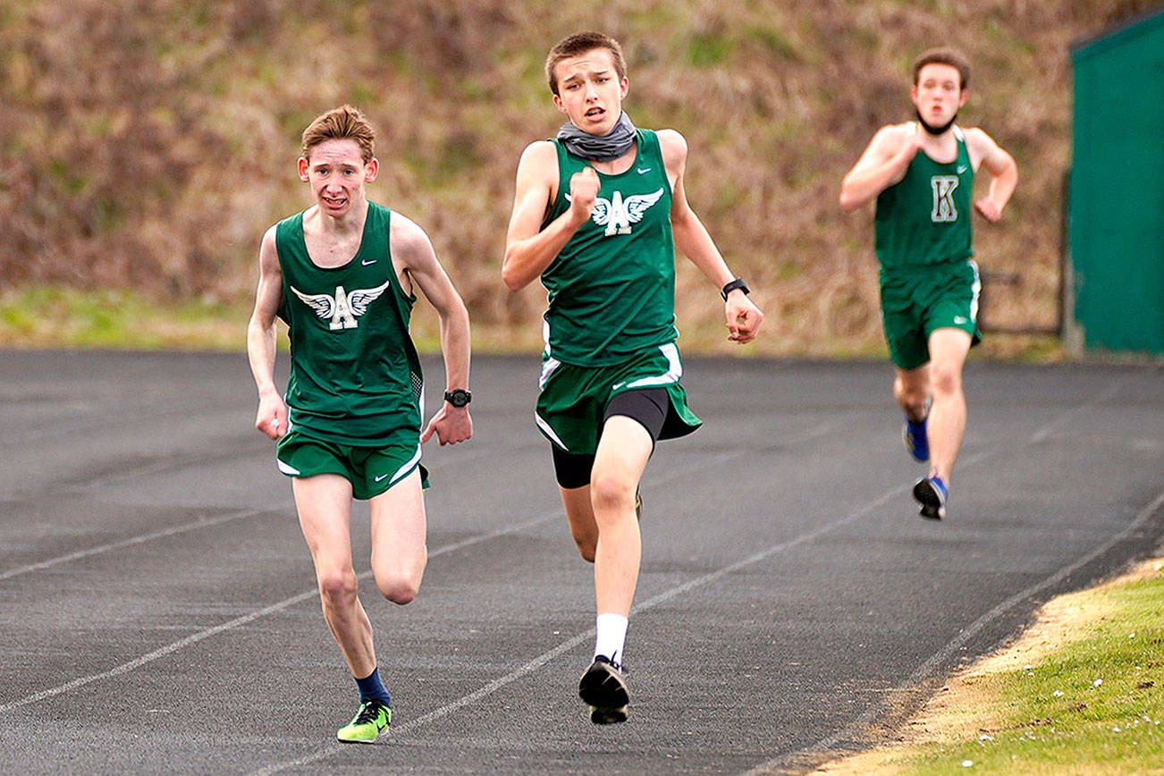 Port Angeles Roughriders finish the 3,000-meter race at the Roughriders track and field jamboree Saturday with Klahowya. From left are Langdon Larson, Port Angeles (10:12.94), Maxwell Baeder, Port Angeles (10:12.85) and Evan Hagle, Klahowya (10:19.75). (Photo courtesy of Loren Larson)