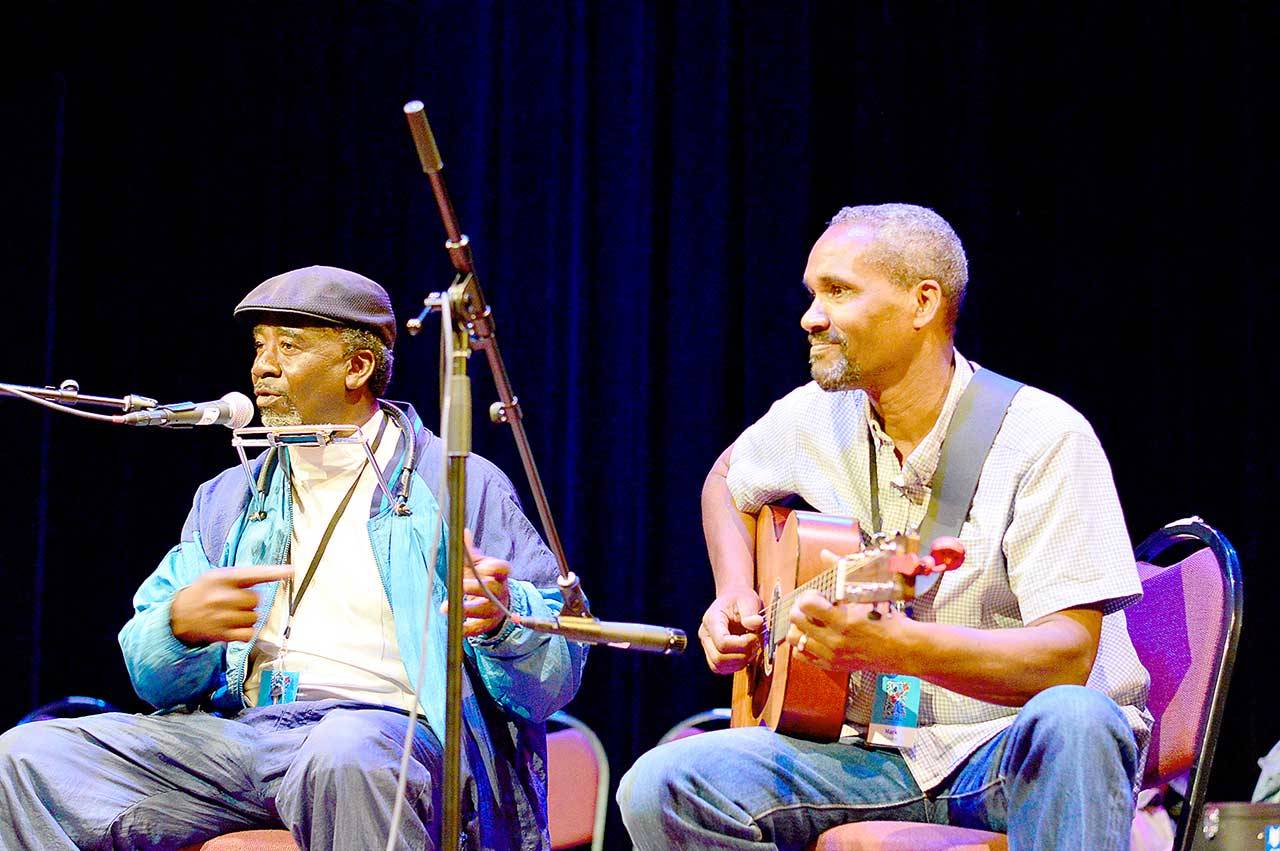 <strong>Diane Urbani de la Paz</strong>/Peninsula Daily News
 Mark Puryear, right, seen with Terry Harmonica Bean in 2019, will be among the teaching artists in Centrum’s Acoustic Blues workshop this summer.