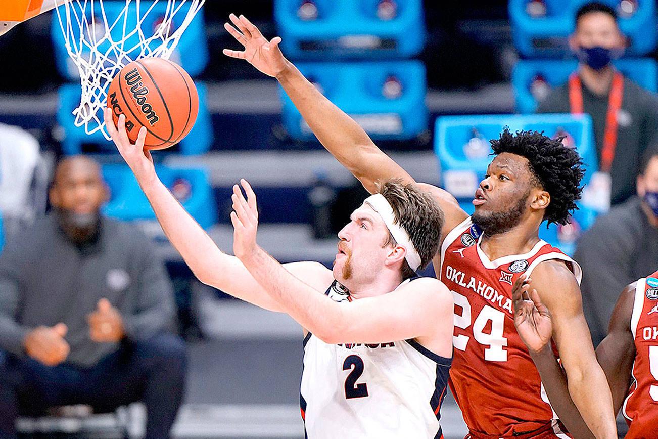 Gonzaga forward Drew Timme (2) shoots under Oklahoma guard Elijah Harkless (24) in the second half of a college basketball game in the second round of the NCAA tournament at Hinkle Fieldhouse in Indianapolis, Monday, March 22, 2021. (AP Photo/AJ Mast)