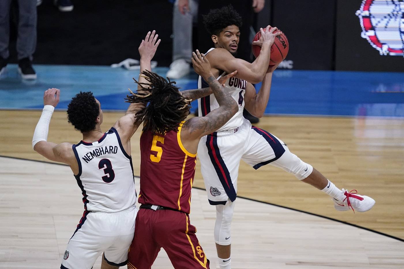 Gonzaga guard Aaron Cook, grabs a rebound over Southern California guard Isaiah White (5) during the first half of an Elite 8 game in the NCAA men’s college basketball tournament at Lucas Oil Stadium, Tuesday, March 30, 2021, in Indianapolis. (AP Photo/Darron Cummings)