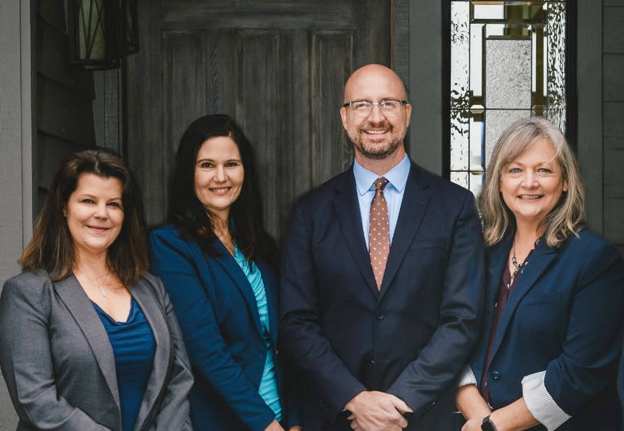 Pictured is Debbie Swanson, office manager; Catherine German, broker/buyers agent; Michael McAleer, realtor; Linda Barnfather, broker/buyers agent.