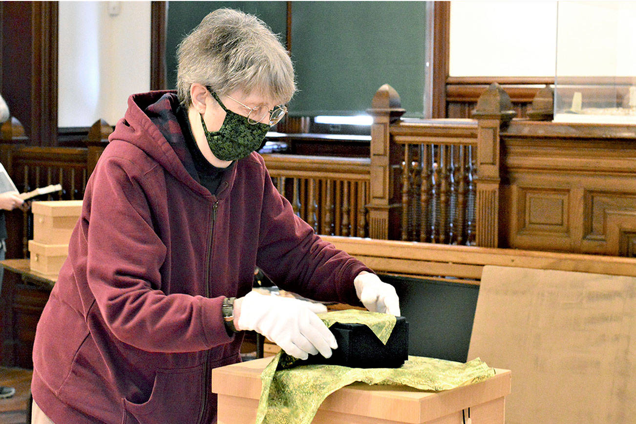 Artist Peggy Smith-Venturi prepares to unveil “Unwrapped,” her new exhibition at the Jefferson Museum of Art & History. The downtown Port Townsend museum reopens Friday. (Diane Urbani de la Paz/Peninsula Daily News)