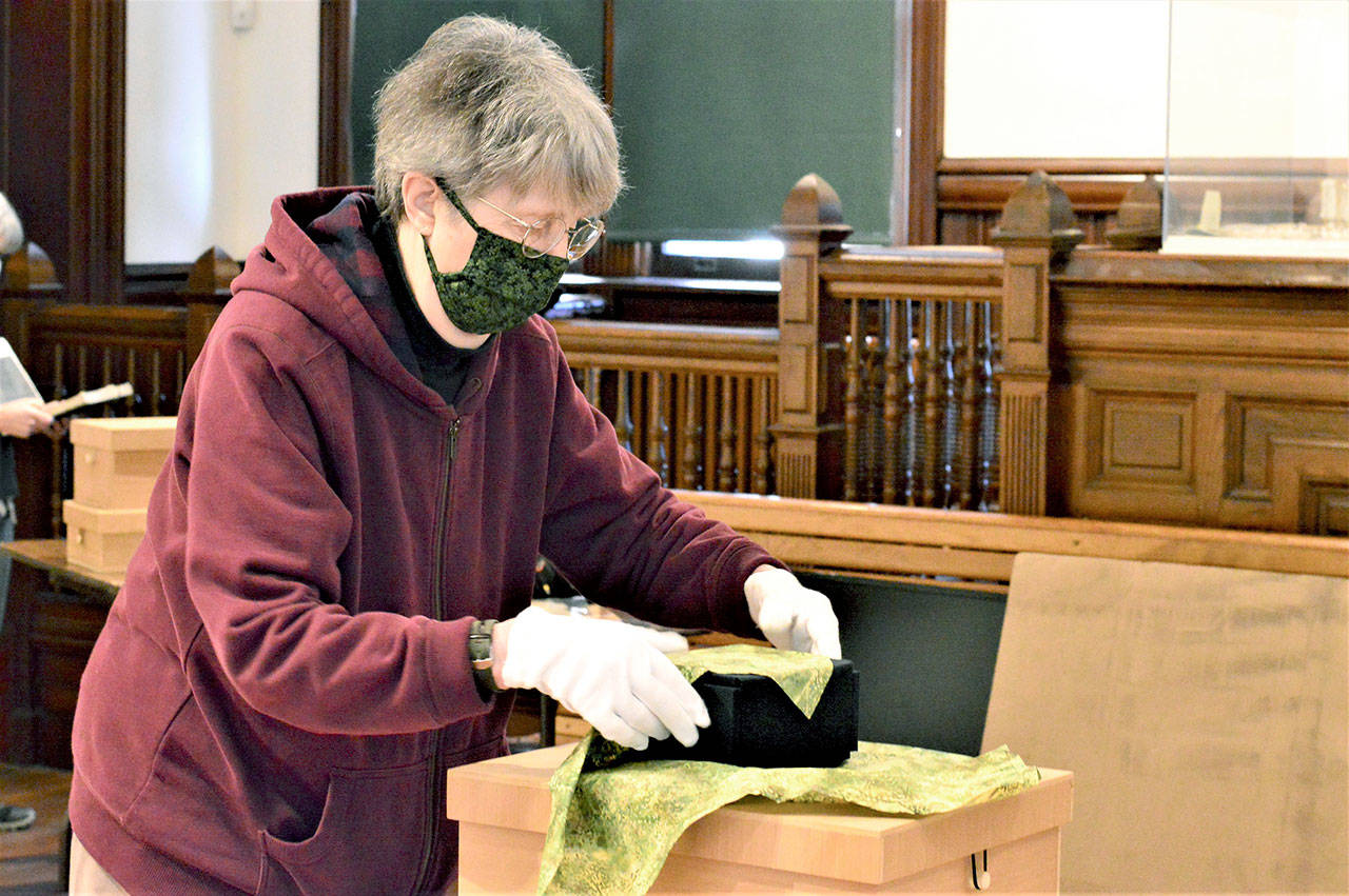 Artist Peggy Smith-Venturi prepares to unveil “Unwrapped,” her new exhibition at the Jefferson Museum of Art & History. The downtown Port Townsend museum reopens Friday. (Diane Urbani de la Paz/Peninsula Daily News)