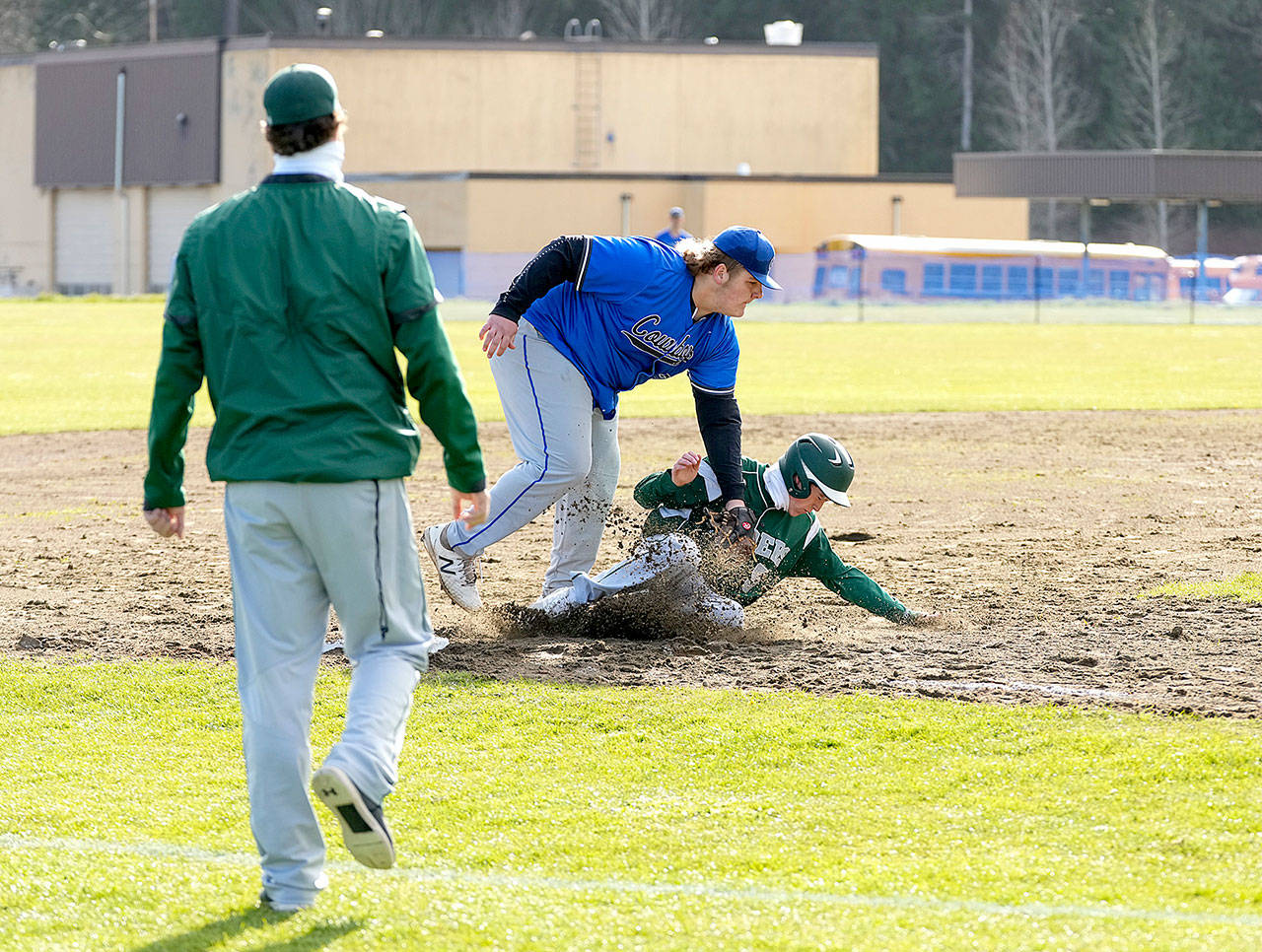 East Jefferson’s Chris Fair gets the out at 3rd on Port Angeles’ Michael Soule during a game played Thursday in Chimacum. (Steve Mullensky/for Peninsula Daily News)