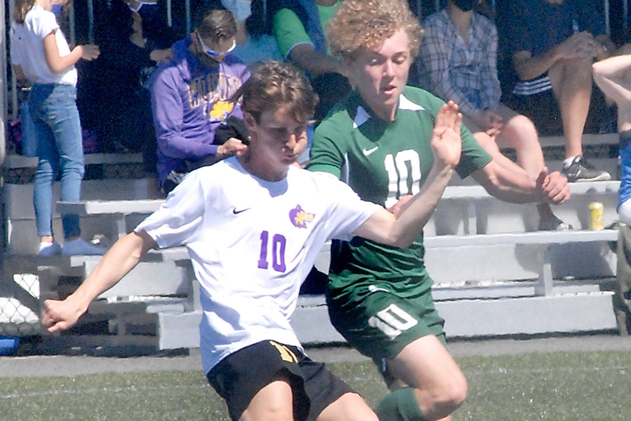Keith Thorpe/Peninsula Daily News
Sequim's Eli Gish, left, and Port Angeles' Damon Gundersen compete for control at midfield on Saturday at Peninsula College.