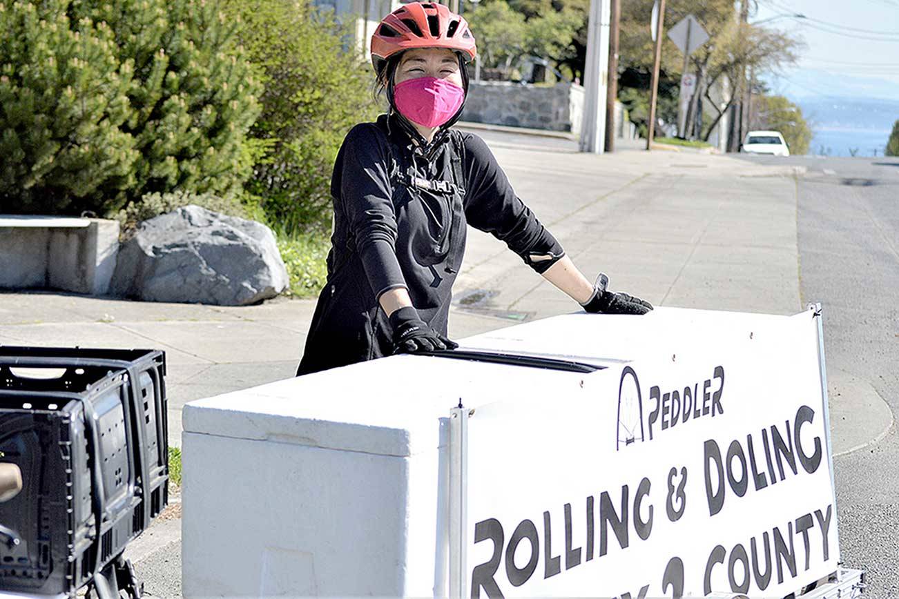 With her Peddler bicycle and trailer, Juri Jennings transports more than her weight in groceries to Port Townsend residents. (Diane Urbani de la Paz/Peninsula Daily News)