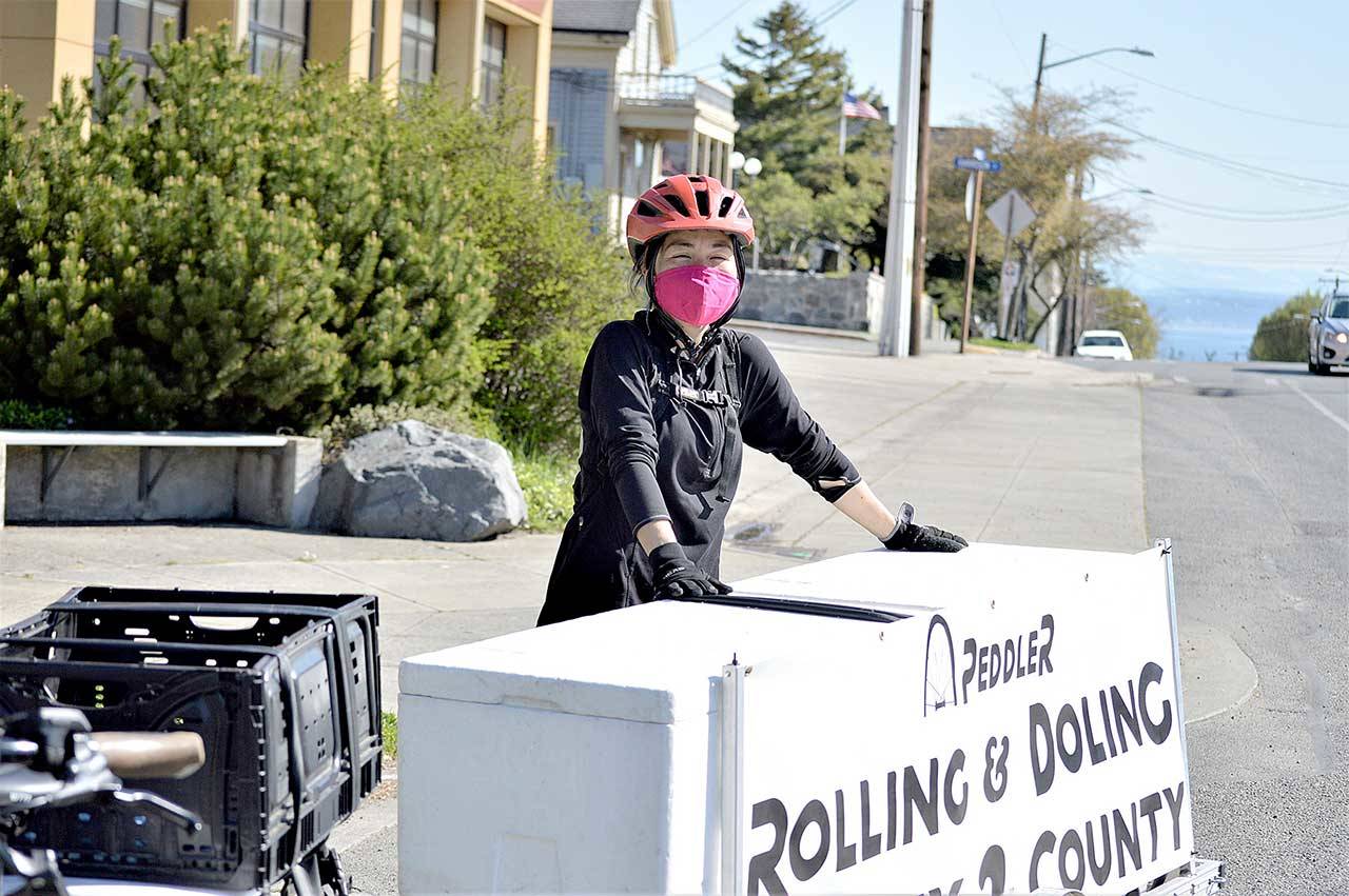 With her Peddler bicycle and trailer, Juri Jennings transports more than her weight in groceries to Port Townsend residents. (Diane Urbani de la Paz/Peninsula Daily News)