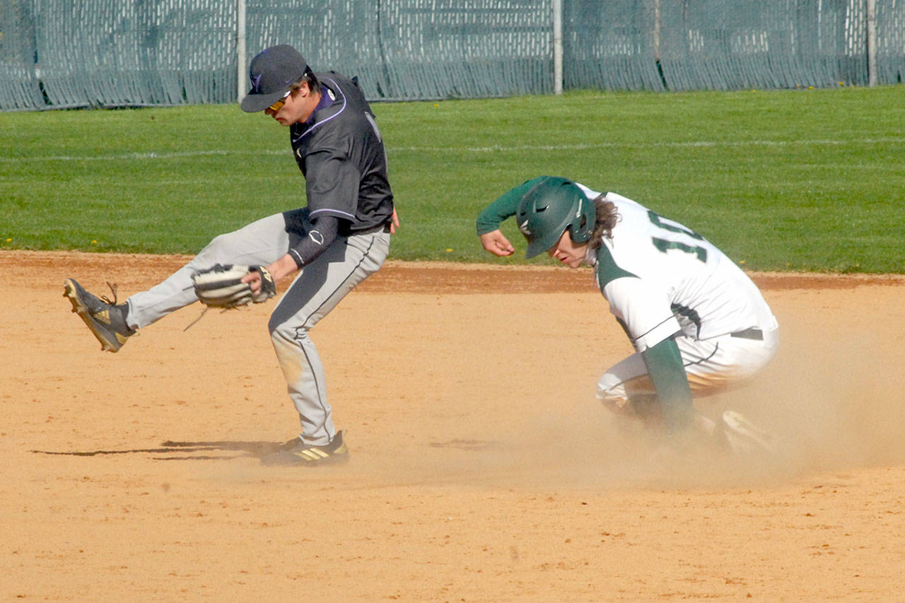 Port Angeles’ Ty Bradow makes it safely to second after a ball thrown to North Kitsap second baseman Zach Edwards goes wild in the second inning on Tuesday in Port Angeles. (Keith Thorpe/Peninsula Daily News)