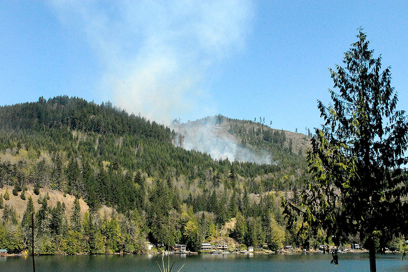 Smoke rises from a wildland fire on state Department of Natural Resources land north of Lake Sutherland on Tuesday. (Keith Thorpe/Peninsula Daily News)