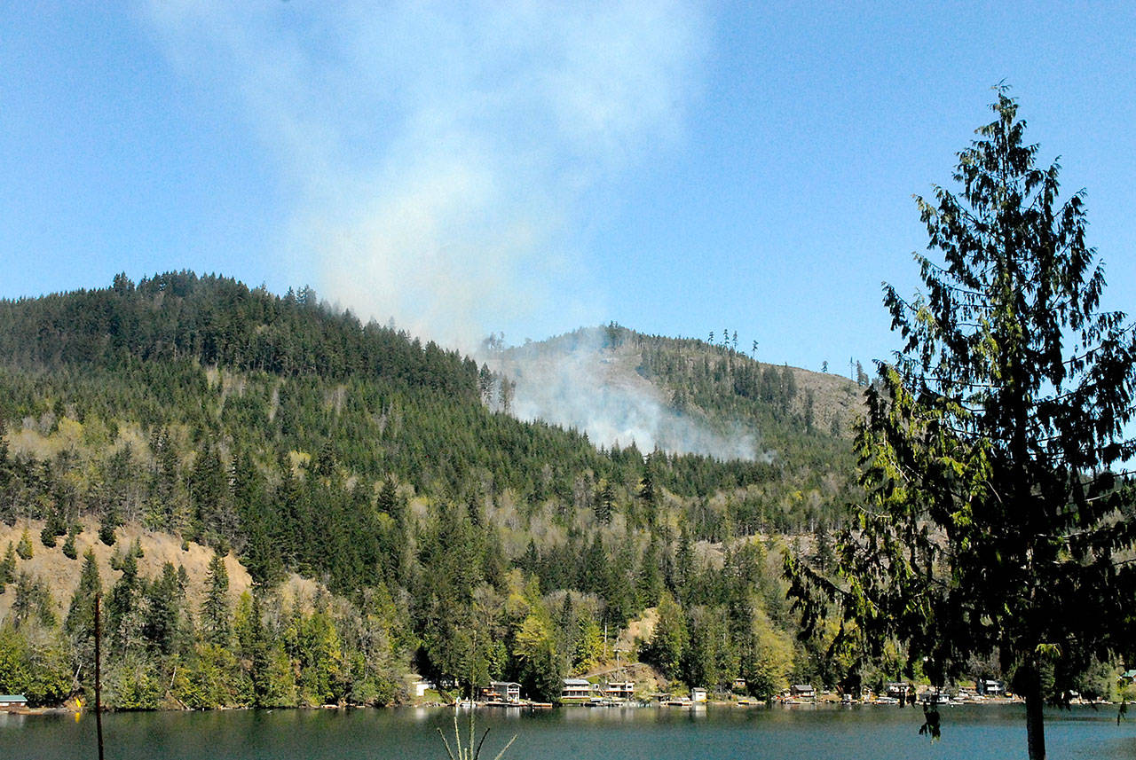 Smoke rises from a wildland fire on Department of Natural Resources land north of Lake Sutherland on Tuesday. (Keith Thorpe/Peninsula Daily News)