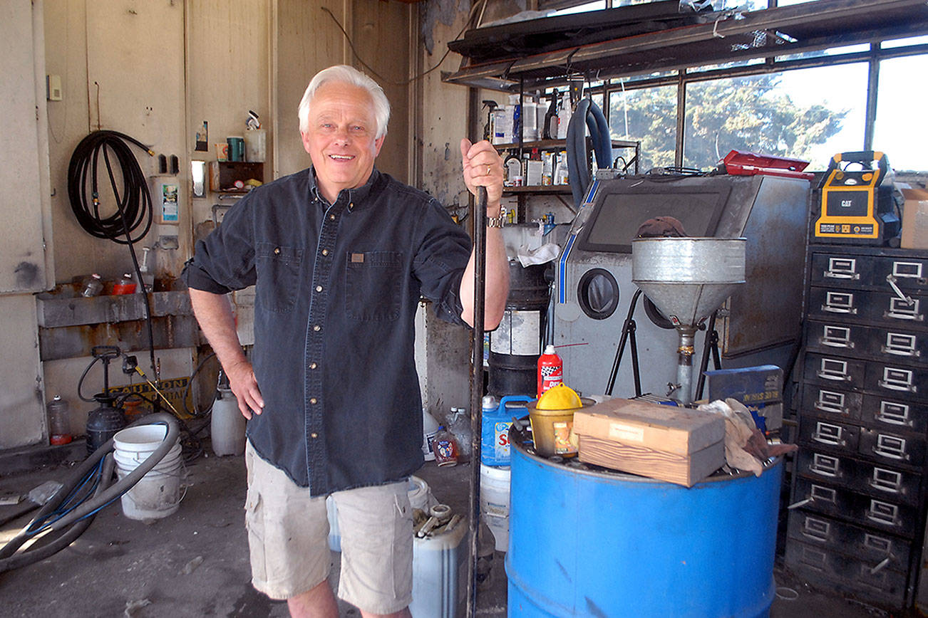 Bob Reid, owner of Reid & Johnson Motors in Port Angeles, stands in the shop area of the establishment on Saturday as he prepares to close the business. (Keith Thorpe/Peninsula Daily News)