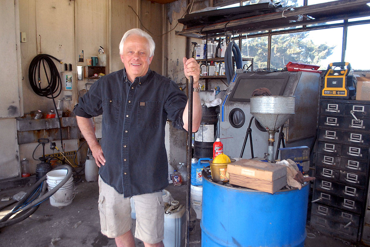 Bob Reid, owner of Reid & Johnson Motors in Port Angeles, stands in the shop area of the establishment on Saturday as he prepares to close the business. (Keith Thorpe/Peninsula Daily News)