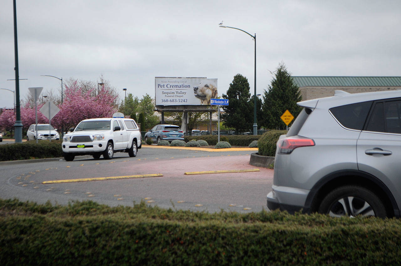 Sequim city staff plan to pave a portion of Washington Street from the Ninth Avenue roundabout to the River Round roundabout this September using a federal grant. (Matthew Nash/Olympic Peninsula News Group)