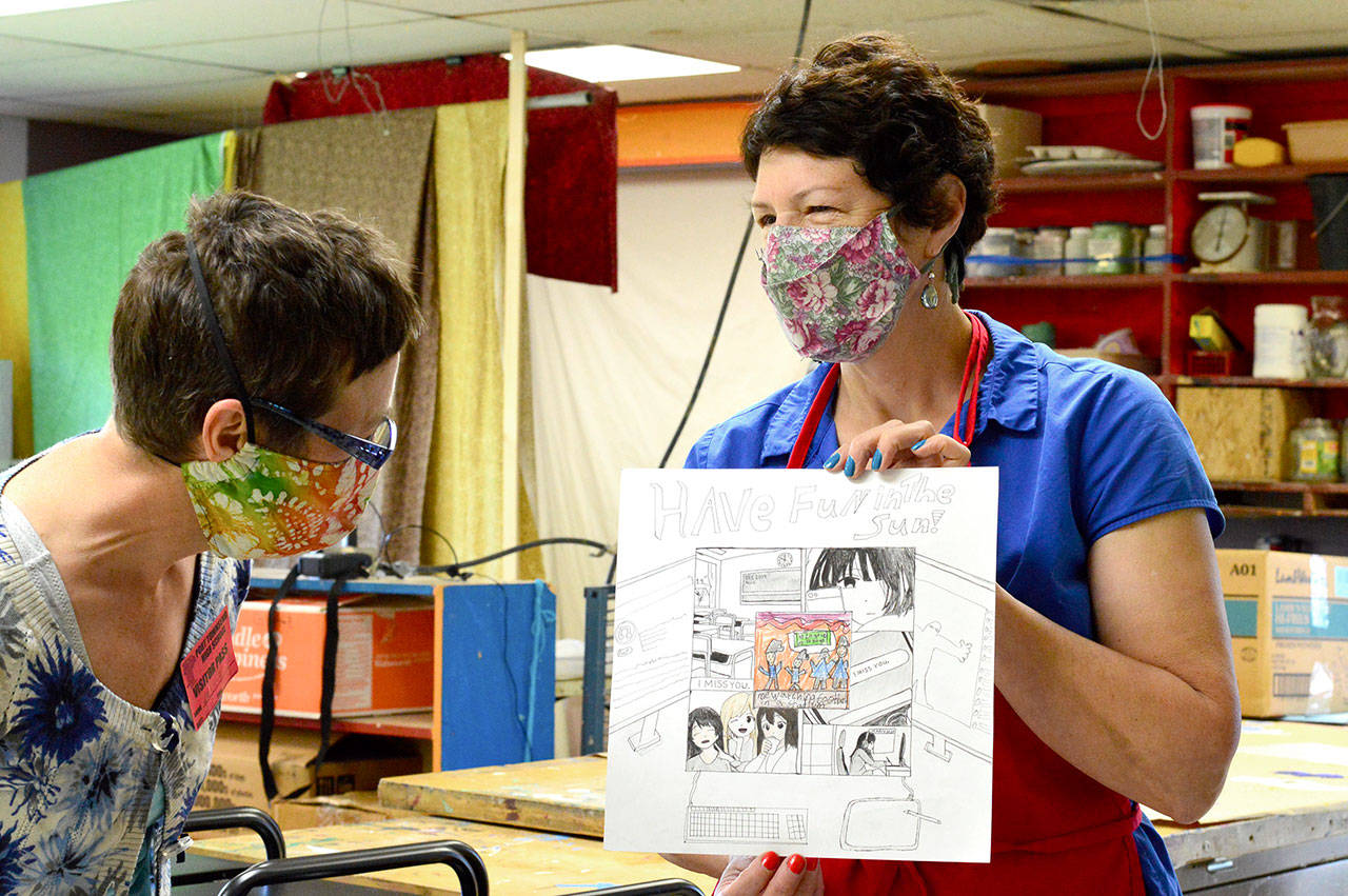 Teaching artist Margie McDonald and Port Townsend High School art teacher Michele Soderstrom worked with students on art panels to be posted through May around Uptown and downtown Port Townsend. The panels are part of the Art Wave! exhibition, which raises awareness and funds for arts education in Port Townsend schools. (Diane Urbani de la Paz/Peninsula Daily News)