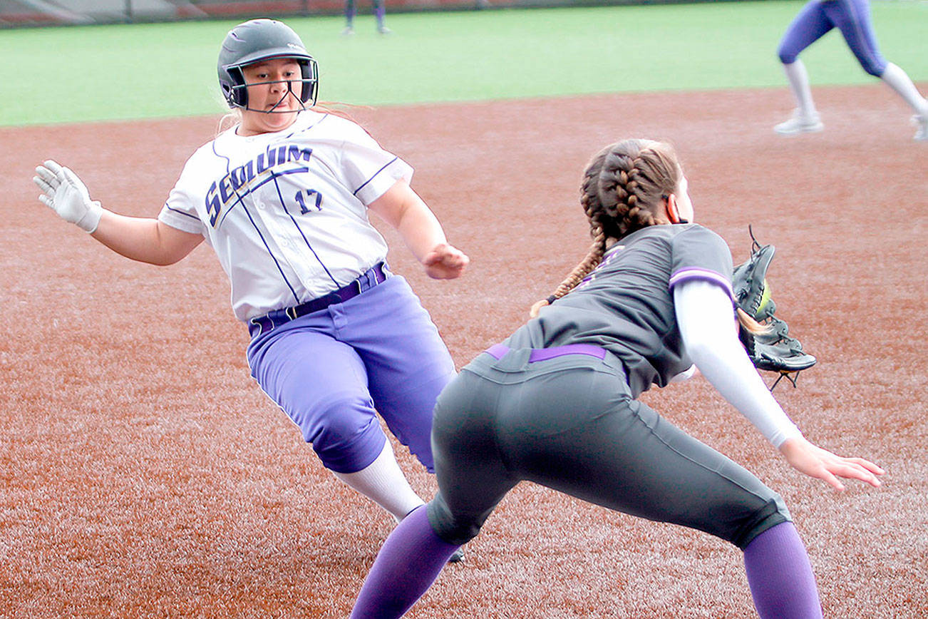 Sequim's Lily Fili slides into third base against North Kitsap on Saturday. (Mark Krulish/Kitsap News Group)