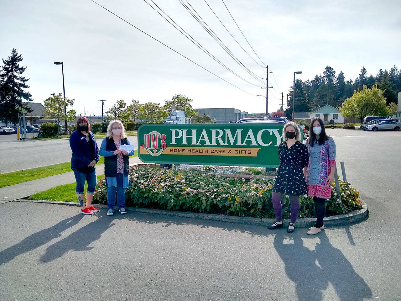 From left are Jessica Thompson, Lori Ambrose, Molly Wallace and JooRi Jun. Staff and customers at Jim’s Pharmacy in Port Angeles raised more than $700 to support Volunteer Hospice of Clallam County, the March recipient of Jim’s Cares Monthly Charity. The funds are raised through monetary donations, used book sales, donated employee casual days and a percentage of over-the-counter sales at Jim’s Pharmacy.