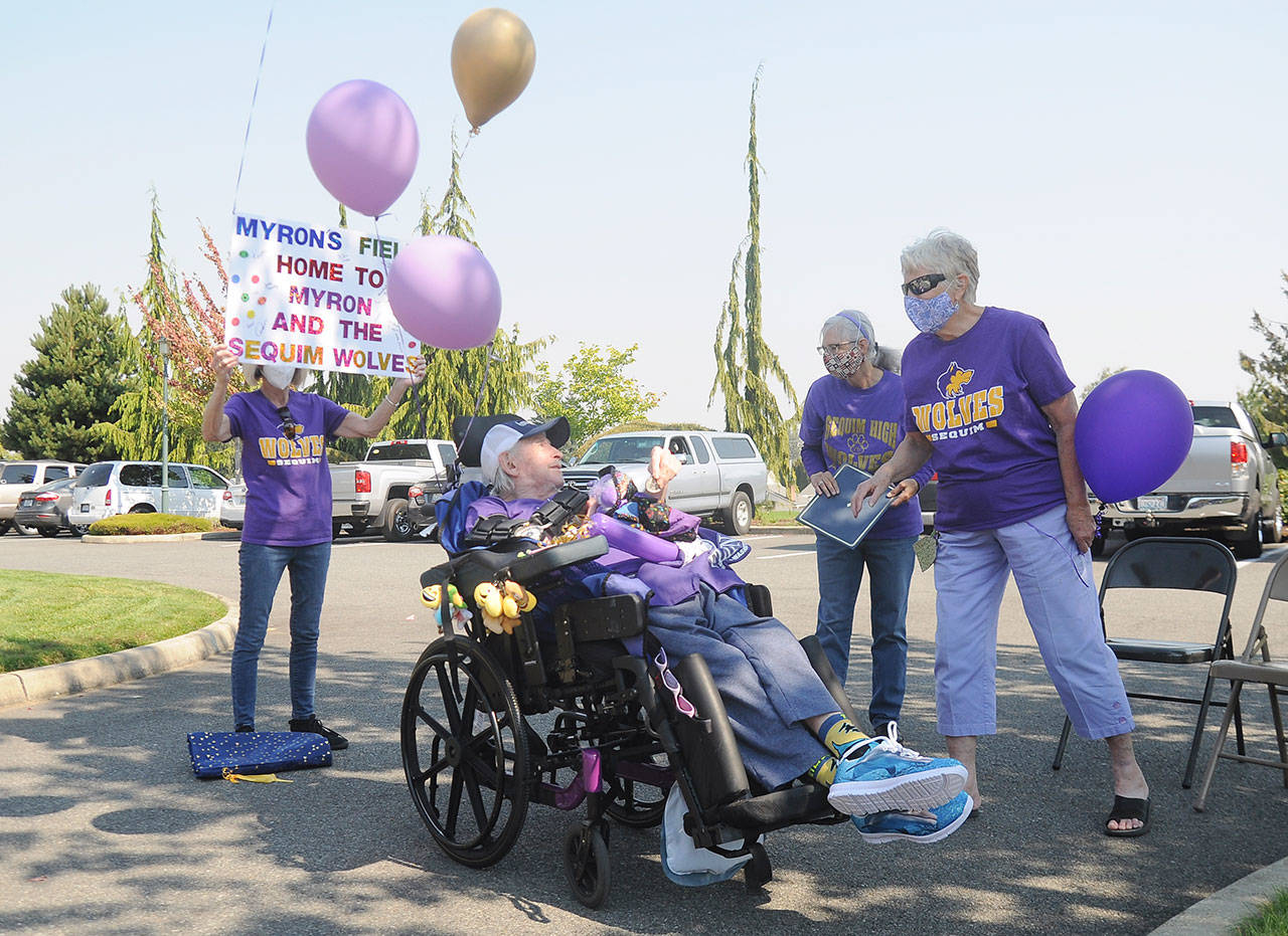 Members of the Sequim Alumni Association meet with Myron Teterud just outside Sequim Health & Rehabilitation Center on Sept. 8. Pictured with Teterud include, from left, Phyllis Meyer, Lorri Gilchrist and Loretta Bilow. Association members are advocating for naming the Sequim High School sports stadium in honor of Teterud, widely known for his avid interest and attendance at SHS sports events. (Michael Dashiell/Olympic Peninsula News Group)