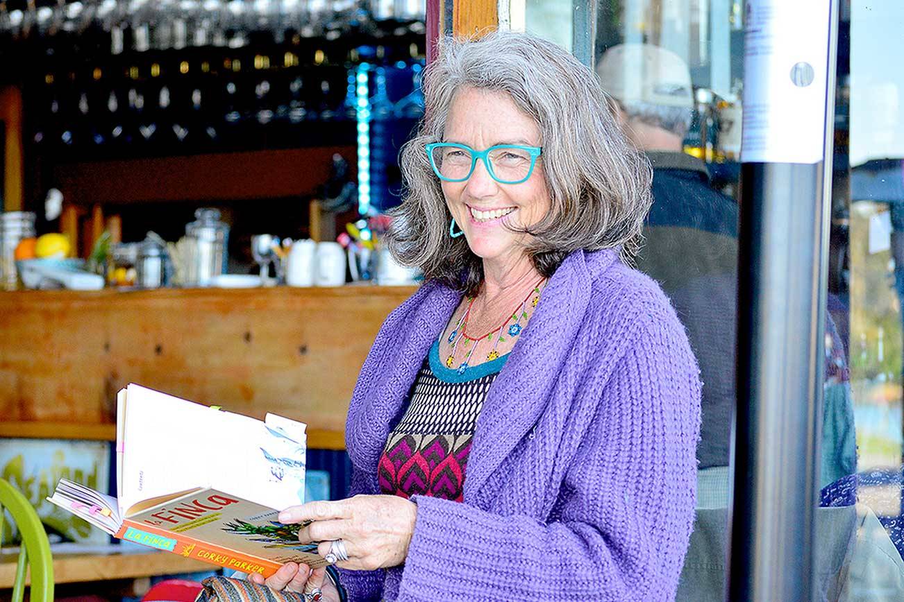 Author Corky Parker of Port Townsend gives a reading at the Ajax Cafe of her new book, “La Finca: Love, Loss and Laundry on a Tiny Puerto Rican Island.” (Diane Urbani de la Paz/Peninsula Daily News)