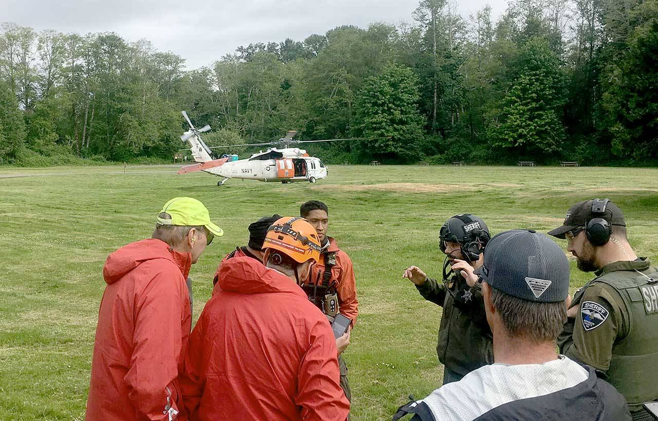 Search and Rescue team members used the Dosewallips State Park’s field as their command post for the multi-agency rescue of two hikers who had fallen down the Brothers Mountain on Sunday afternoon. Teams from Jefferson Search and Rescue, Jefferson County Sheriff’s Office, Naval Air Station Whidbey Island Search and Rescue and Olympic Mountain Rescue responded to the emergency. (Jefferson Search and Rescue)