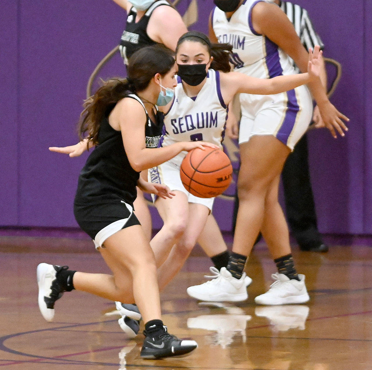 Sequim’s Hannah Bates cuts off a Klahowya opponent’s drive to the basket during the Wolves’ 68-8 win over the Eagles on Tuesday. (Michael Dashiell/Olympic Peninsula News Group)