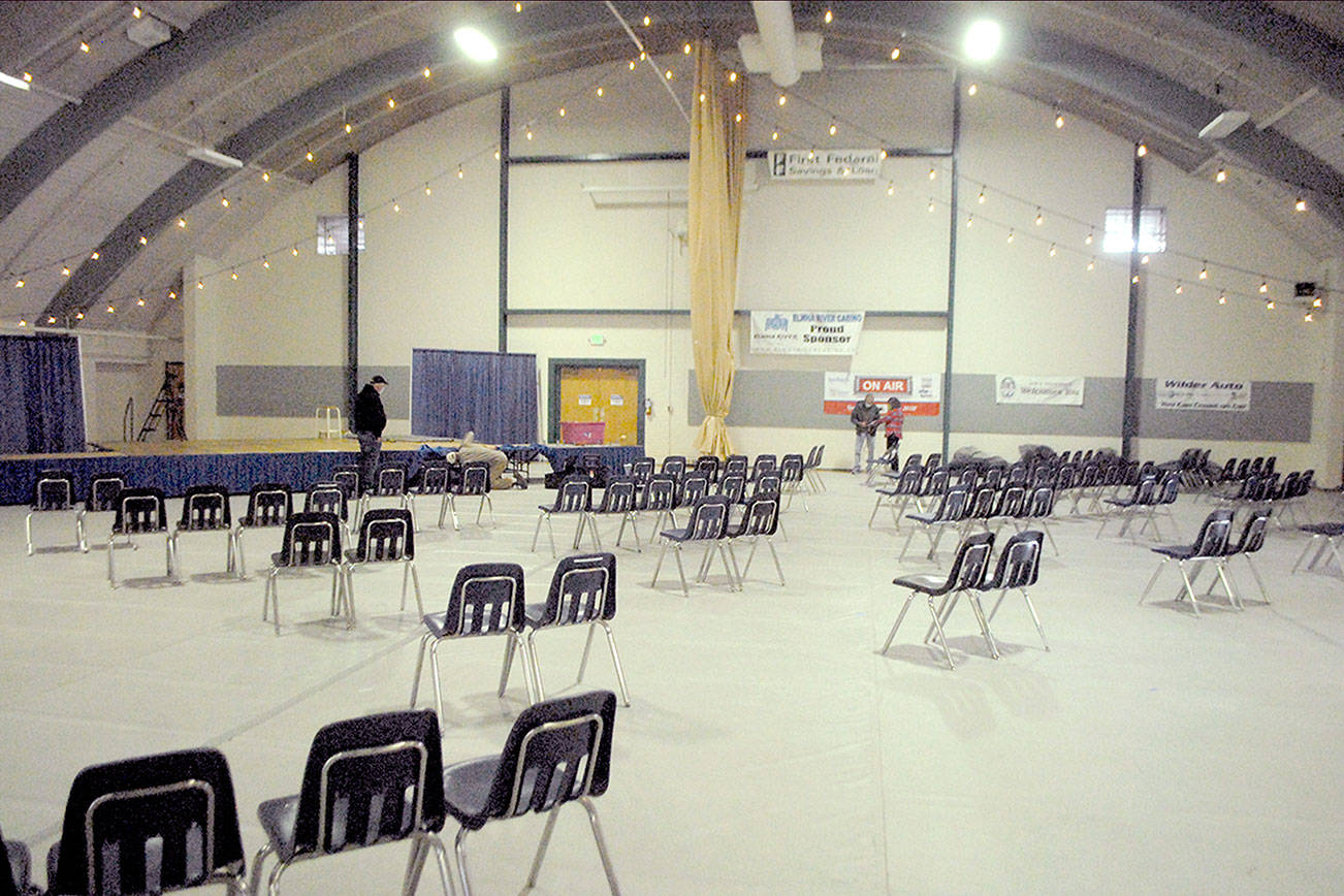 Workers set up the stage on Thursday in Vern Burton Community Center for this weekend’s scaled-down version of the Juan de Fuca Festival of the Arts in Port Angeles. (Keith Thorpe/Peninsula Daily News)