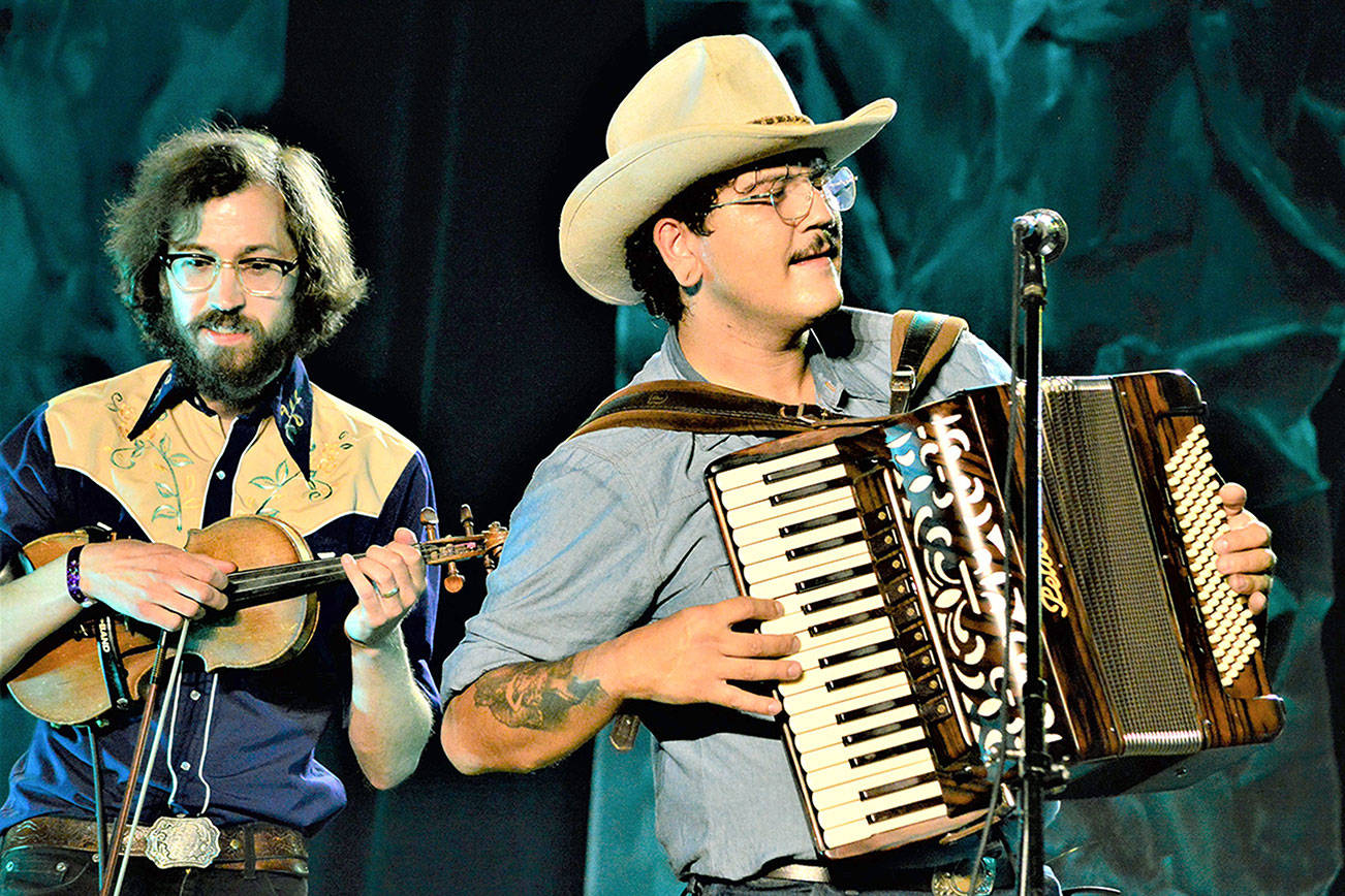 During the Juan de Fuca Festival in Port Angeles, the band Gus Clark and the Least of His Problems -- with Jonah Byrne, left, and Clark -- provided a Saturday night set of country music inside the Vern Burton Community Center. The festival included a street fair and live concerts plus 20 virtual performances, which are still available via the Juan de Fuca Foundation for the Arts website, JFFA.org/festival. Diane Urbani de la Paz/Peninsula Daily News