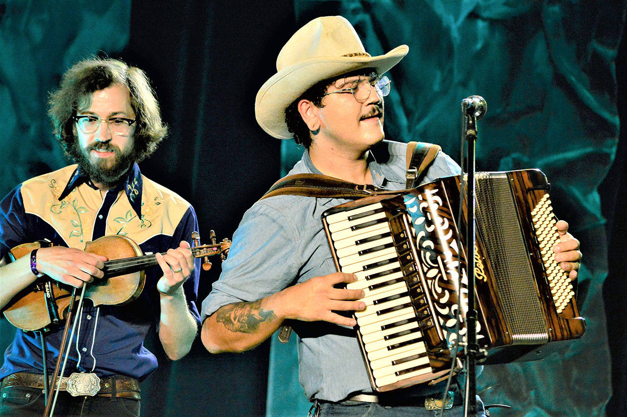 During the Juan de Fuca Festival in Port Angeles, the band Gus Clark and the Least of His Problems — with Jonah Byrne, left, and Clark — provided a Saturday night set of country music inside the Vern Burton Community Center. The festival included a street fair and live concerts plus 20 virtual performances, which are still available via the Juan de Fuca Foundation for the Arts website, JFFA.org/festival. (Diane Urbani de la Paz/Peninsula Daily News)