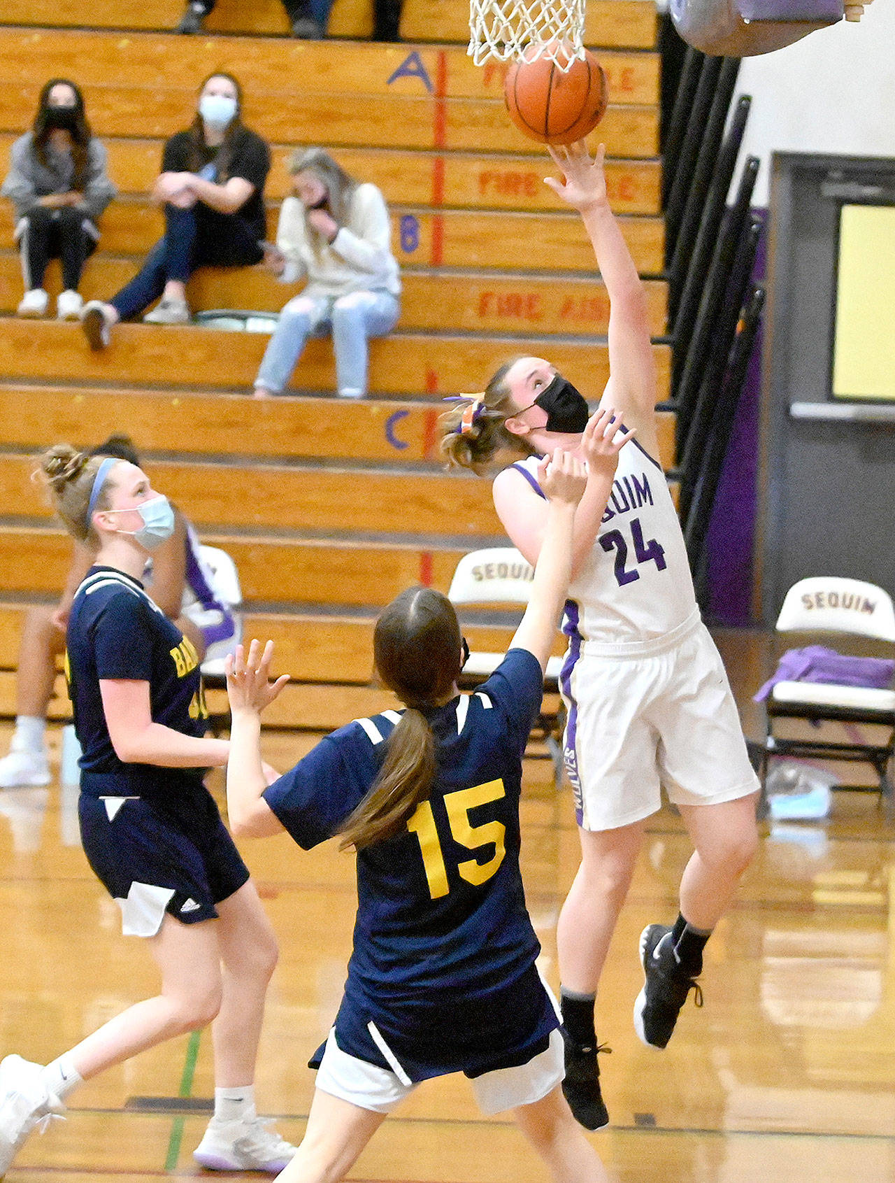 Sequim’s Malory Morey goes up for a shot against Bainbridge on Saturday. Sequim won 66-17. (Michael Dashiell/Olympic Peninsula News Group)