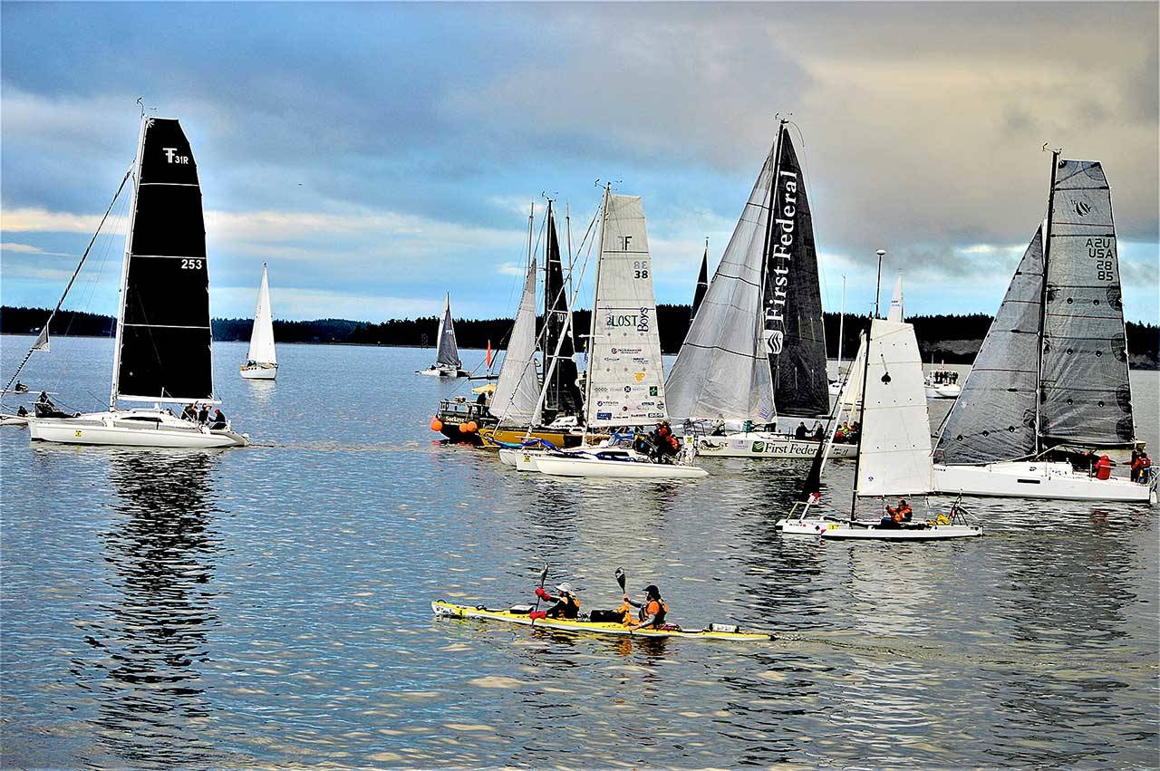 Team Bendracing — kayakers Daniel Staudigel and Jason Magness of Bend, Ore. — set out with the rest of the racers in the WA360, the 360-mile, human- and wind-powered event that began in Port Townsend Bay at 6 a.m. Monday. (Diane Urbani de la Paz/Peninsula Daily News)