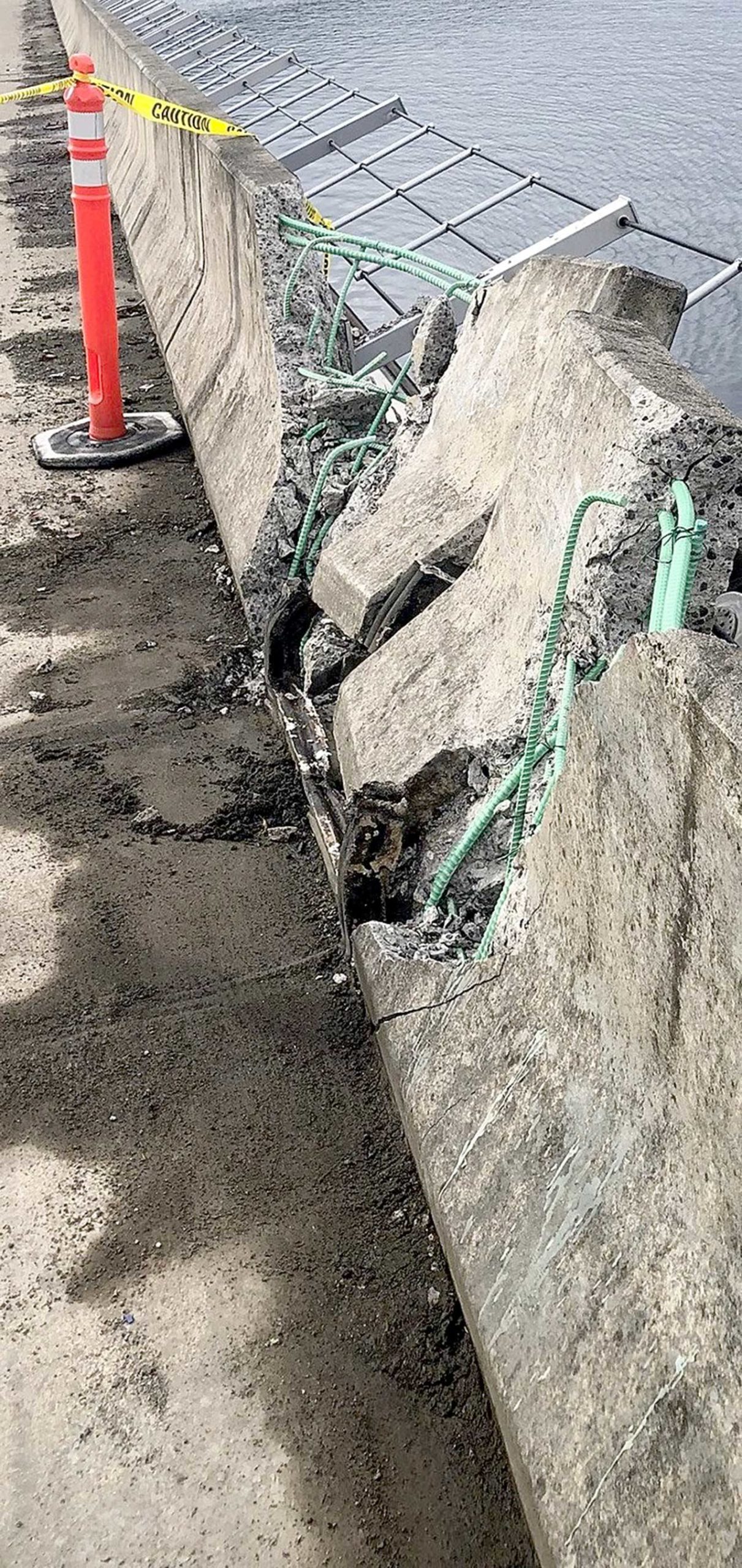 The Hood Canal Bridge was closed in both directions following an overnight or early morning collision that caused damage to the bridge. State Department of Transportation crews worked to fix the damage Wednesday afternoon. The State Patrol is investigating the incident as a hit-and-run. (Washington State Patrol)
