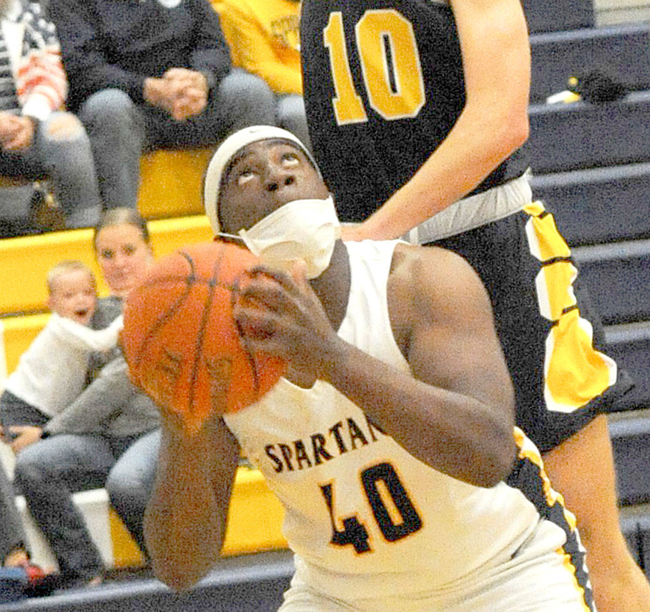 Forks’ Trey Baysinger (40) was named the Most Valuable Player of the boys basketball 2B Pacific League last week. (Lonnie Archibald/for Peninsula Daily News)