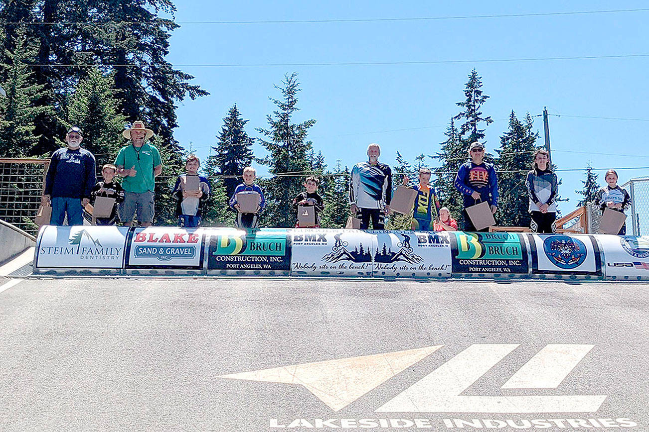 These Lincoln Park BMX racers raised $5,500 for the Race for Life fundraisers. From left, are George Williams, Bradan Gray, track operator Sean Coleman, Zebastian Ferrier-Dixon, Kristopher Giffin, Bennett Gray, Wayne Goldsbary, Orion Hedin, Andy Goldsbary, Cash Coleman and Kylin Weitz.