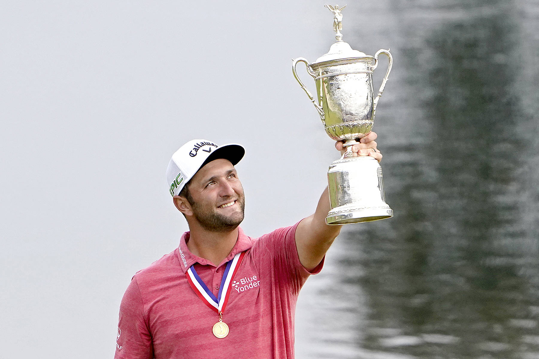 Jon Rahm of Spain holds the champions trophy for photographers after the final round of the U.S. Open Golf Championship, Sunday, June 20, 2021, at Torrey Pines Golf Course in San Diego. (Jae C. Hong/The Associated Press)