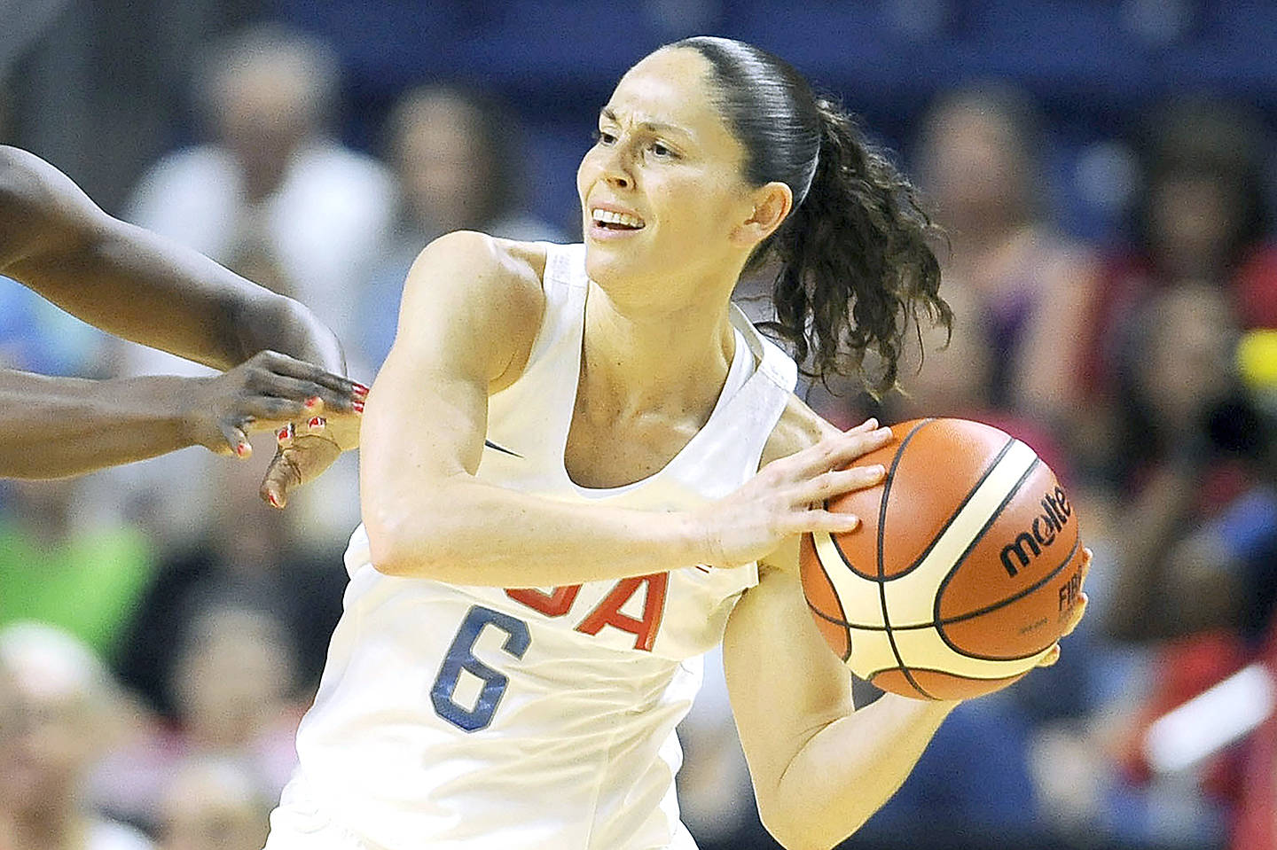 FILE - United States' Sue Bird, right, is defended during the first half of a women's exhibition basketball game against Canada  in Bridgeport, Conn., in this Friday, July 29, 2016, file photo. Sue Bird and Diana Taurasi will try and become the first five-time Olympic gold medalists in basketball as they lead the U.S women's team at the Tokyo Games. The duo was selected for their fifth Olympics on Monday, June 21, 2021, joining Teresa Edwards as the only basketball players in U.S. history to play in five.(AP Photo/Jessica Hill, FIle)