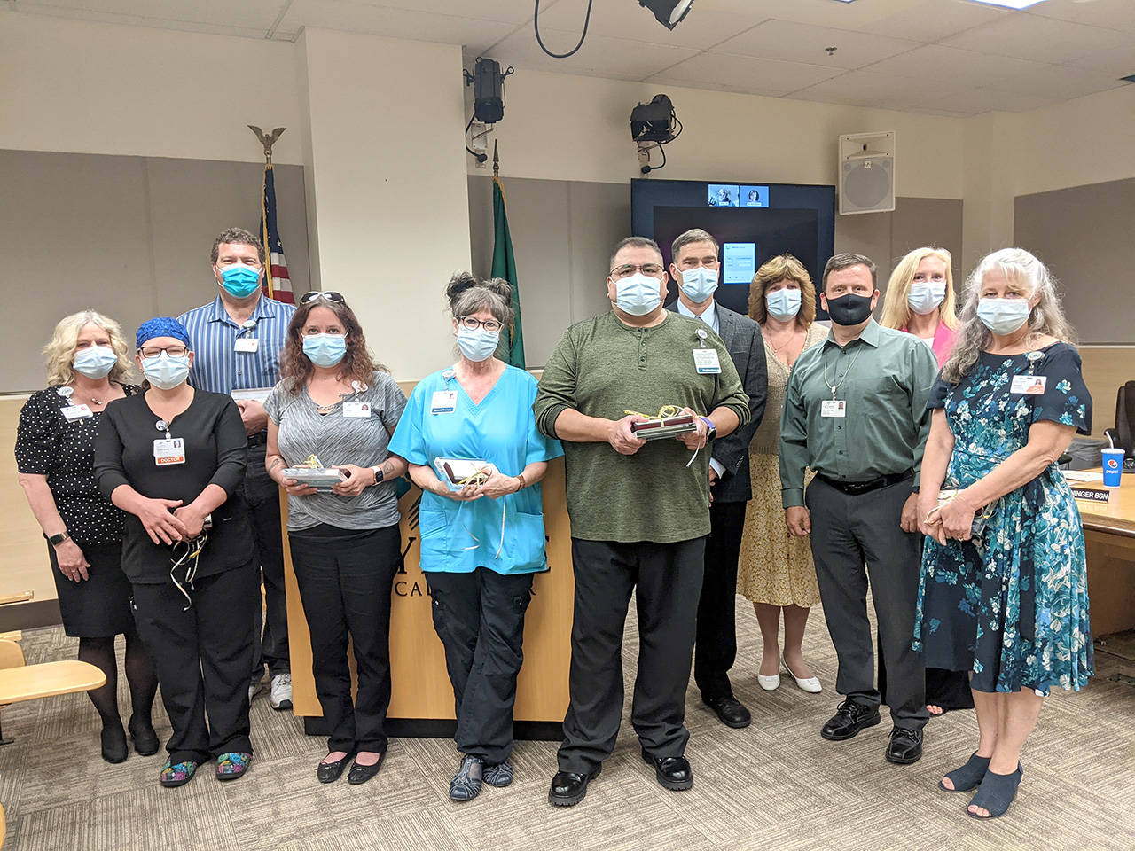 Olympic Medical Center recently honored its 2021 Patient Experience Champions. From left are Patti Haught, Olympic Medical Center patient experience director; Dr. Phyllis Slife; Richard DeCou; Renae Winston; Debe Stallings; John Blevins; Darryl Wolfe, OMC CEO; Michelle McFall, patient experience manager; John Nutter, OMC board president; Jennifer Burkhardt, chief human resources officer; and Debbie Campbell.