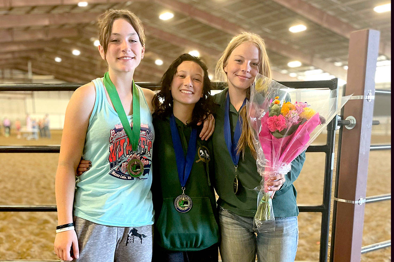Photo by Katharyn Rivers

Cutline: Congratulations to PA’s high school equestrian team for winning medals  at the WAHSET State Finals held last weekend in Moses Lake. Sara Holland, left, won the bronze while  Sydney Hutton’s high score gained  her first place and the gold medal in Hunt Seat Equitation over fences.  Amelia Kinney, right, triumphed over all with a first place time of 3.89 that helped her bring  home the gold in Breakaway roping.