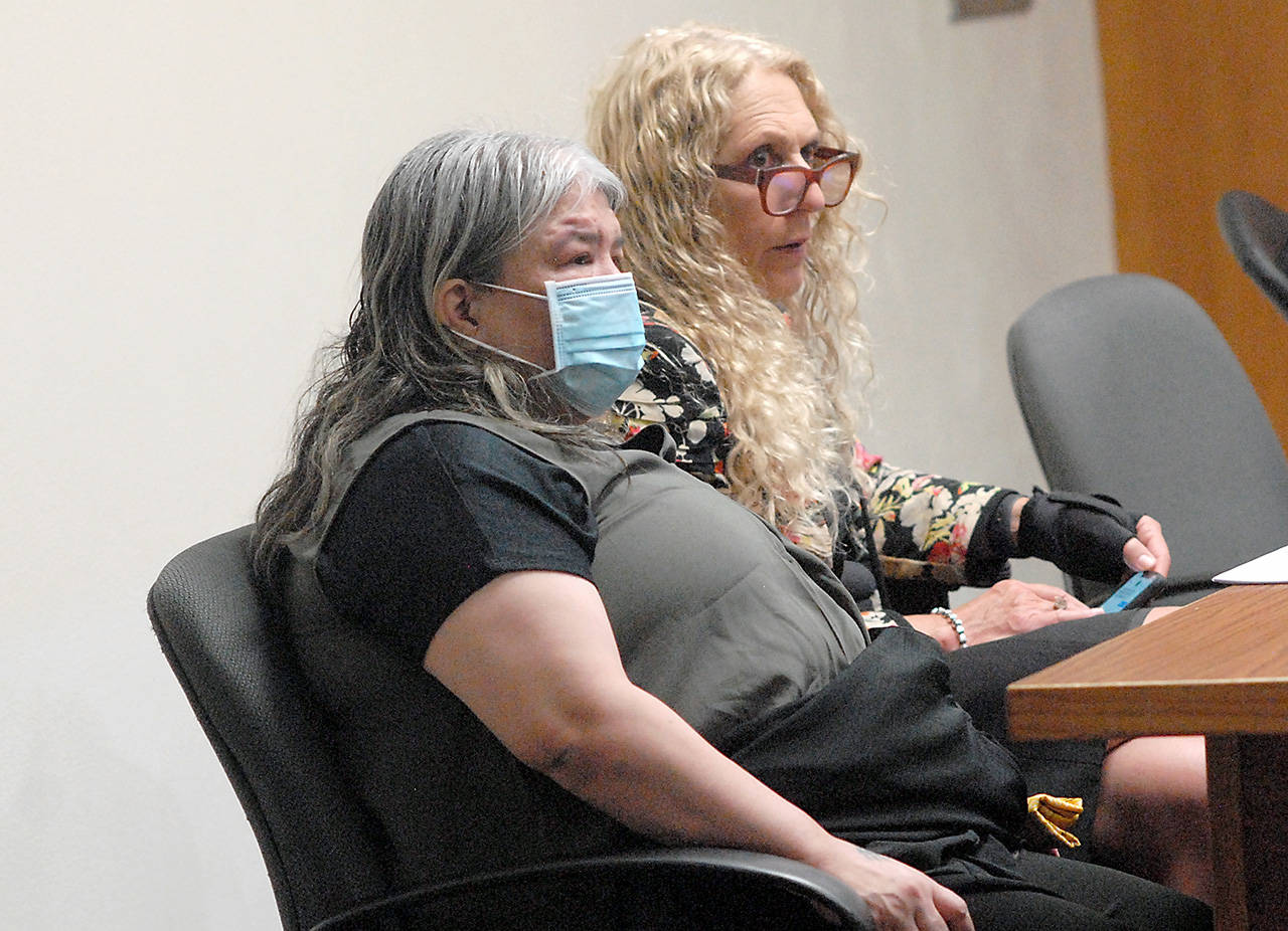 Larisa Jean Dietz, 50, of Sequim, front, sits with attorney Karen Unger in Clallam County Superior Court on Wednesday. Dietz is charged with first-degree assault and attempted second-degree murder in the Oct. 8, 2019, stabbing of a wheelchair-bound Sequim man she said had groped her. (Keith Thorpe/Peninsula Daily News)