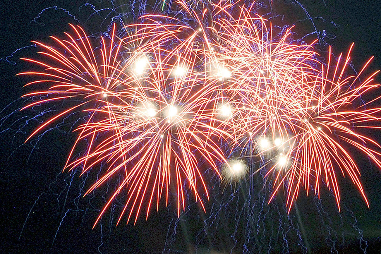 Bursts of fireworks light up the sky over Port Angeles Harbor during the 2019 Independence Day display. (Keith Thorpe/Peninsula Daily News)