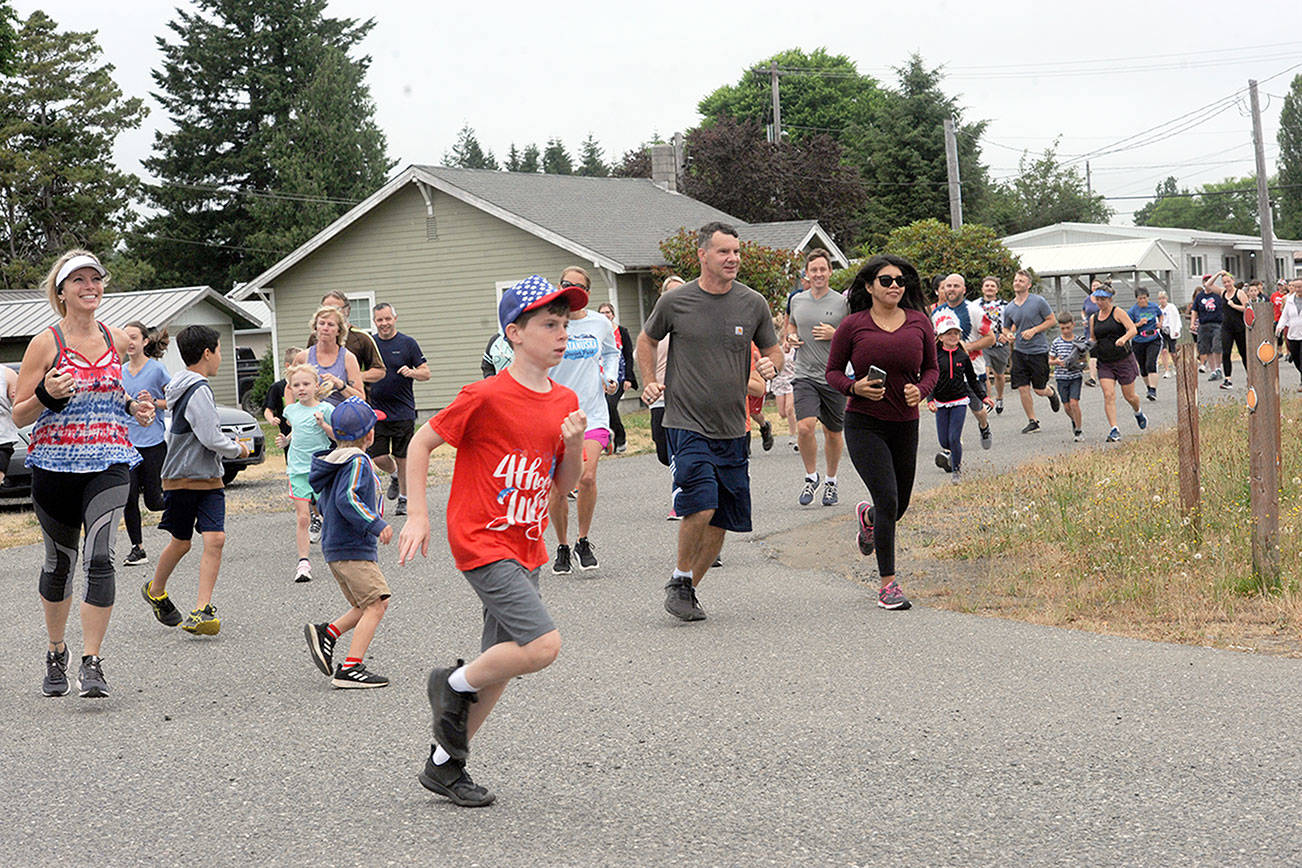 Lonnie Archibald/for Peninsula Daily News
They were off running and walking in Forks during Saturday's Fourth of July Fun Run presented by the Forks Community Hospital. The celebration peaks today with a Grand Parade and a host of other events.