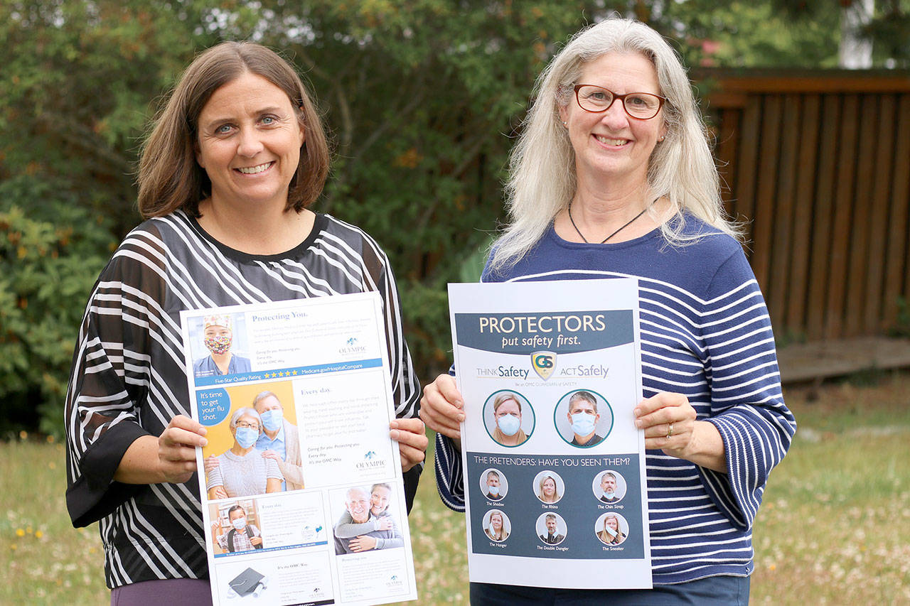 Olympic Medical Center’s marketing and communications team, Director Bobby Beeman, left, and Senior Marketing Coordinator Donna Pacheco show the posters that won them two gold medals in the 2021 Aster Awards for excellence in advertising and marketing. The team was honored for its advertising series “The OMC Way” and for its educational flier “Protectors vs. Pretenders,” which showed patients and visitors the correct way to wear masks.