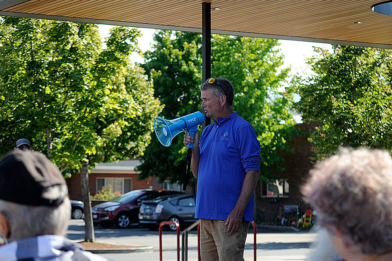 Gary Butler with Sequim’s parks department thanks fellow staffers for their efforts and leadership in recent months during a rally last week in front of the Sequim Civic Center. (Matthew Nash/Olympic Peninsula News Group)