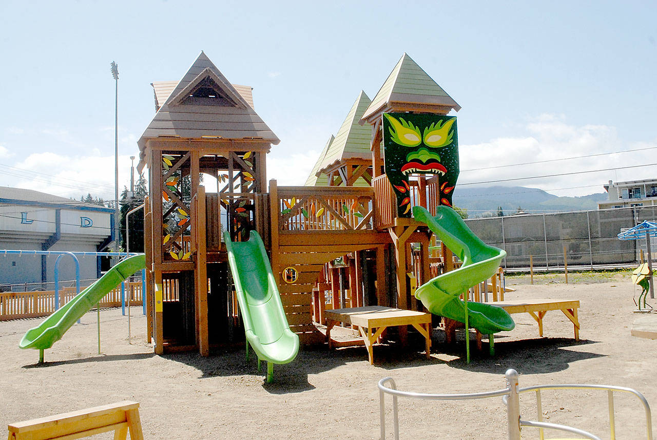The centerpiece play structure of the Generation II Dream Playground at Erickson Playfield stands over the surrounding play area Thursday in Port Angeles. Organizers from the nonprofit Dream Playground foundation have scheduled a work session to complete the playground from 8 a.m. to noon on Sunday. Volunteers are asked to bring their own cordless woodworking and landscaping tools. Play surface installation is scheduled to begin Aug. 2 with a soft opening and ribbon cutting planned for Aug. 14. (Keith Thorpe/Peninsula Daily News)