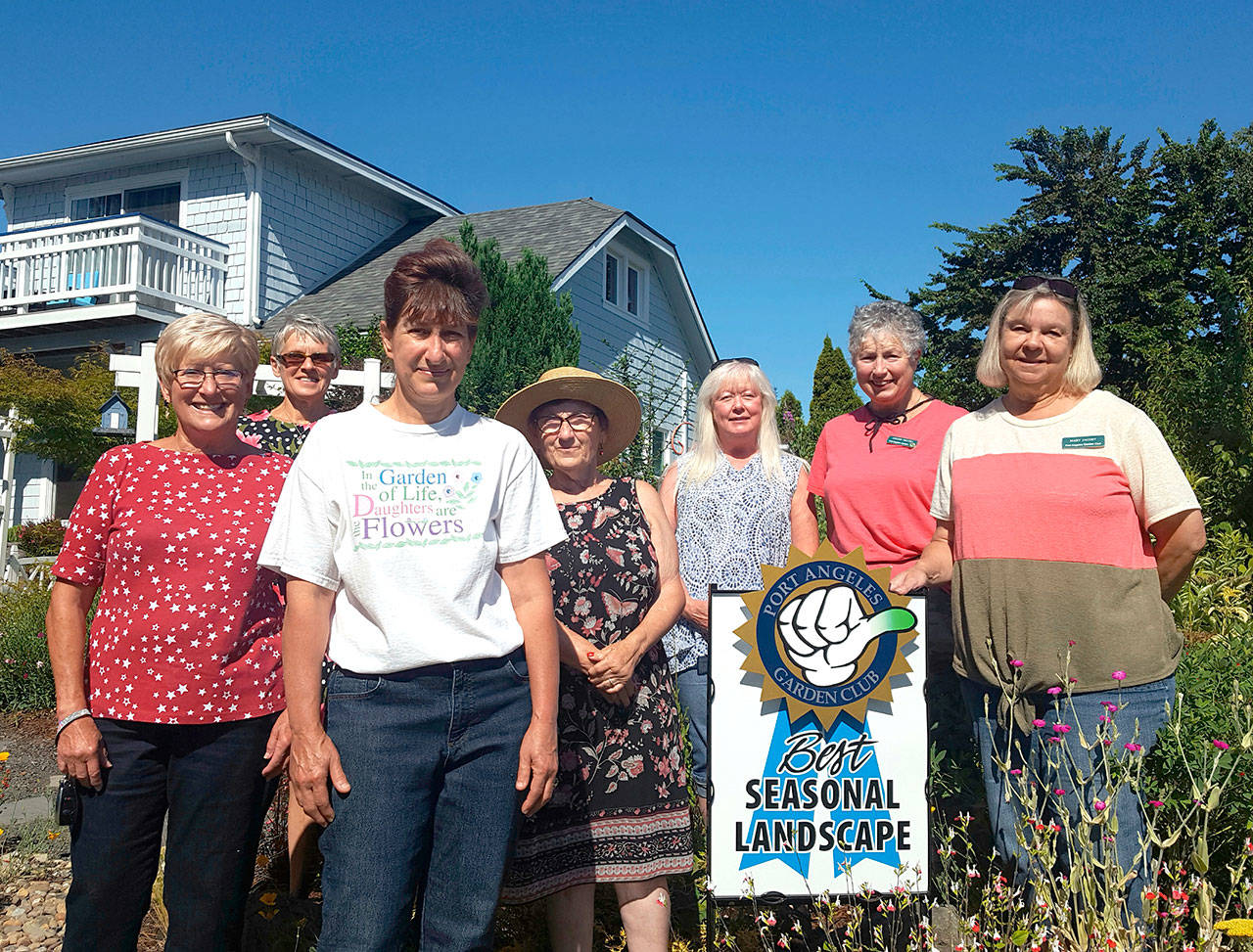 The Port Angeles Garden Club has announced Terri Coleman as the summer Green Thumb award winner. Coleman received the award for excellence in landscaping at her home at 904 W. 13th St. The garden club selects a residential garden for its Green Thumb Award in spring, summer and fall. To be considered, the garden must be planted and maintained by the homeowner without professional landscaping. From left are Pam Ehtee, Ela Ploch, Terri Coleman, Beth Kremer, Shannon Bird, Leiann Niccoli and Mary Jacoby.