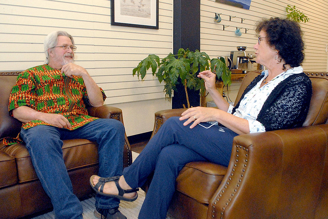 Keith Thorpe/Peninsula Daily News
Doc Reiss, left, talks with Kathi Pressley in Port Angeles. Pressley will take over as the U.S. contact for the Dignity Toilets for Togo project that Reiss started while he is in African beginning an off-shoot business.
