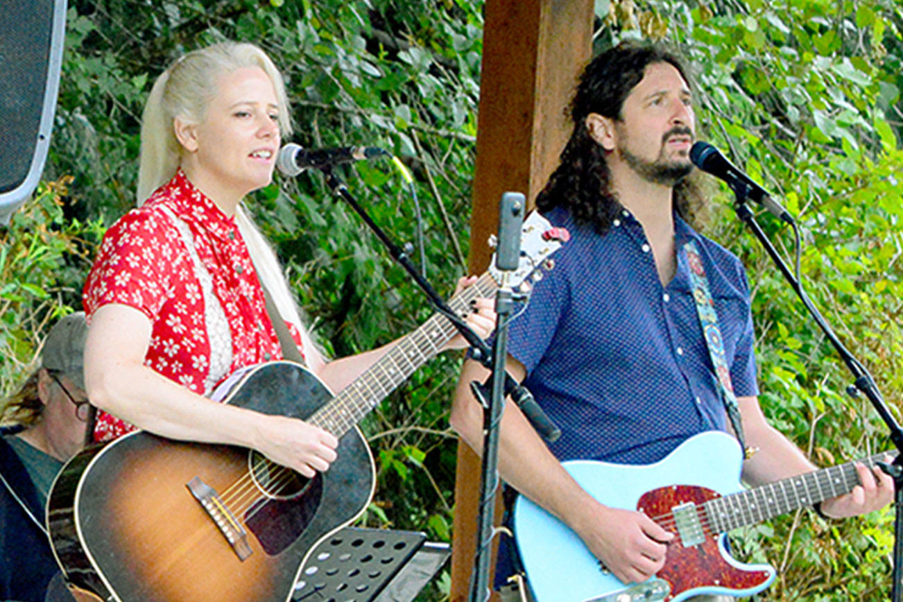 Amid the Saturday afternoon drizzle, the Seattle band Great American Trainwreck brought country and rock to the Laurel B. Johnson Community Center in Coyle. The Concerts in the Woods series (coyleconcerts.com) is presenting free outdoor shows this summer. (Diane Urbani de la Paz/Peninsula Daily News)