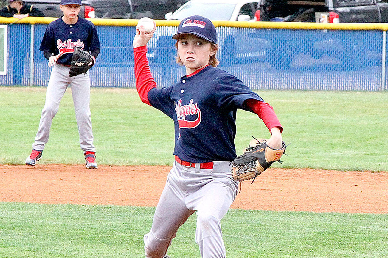 Cameron Colfax of the Port Angeles 12s fires to home plate against the Federal Way Outlaws at the Dick Brown Memorial Baseball Tournament held this weekend at Lincoln Park. He struck out the side. (Dave Logan/for Peninsula Daily News)