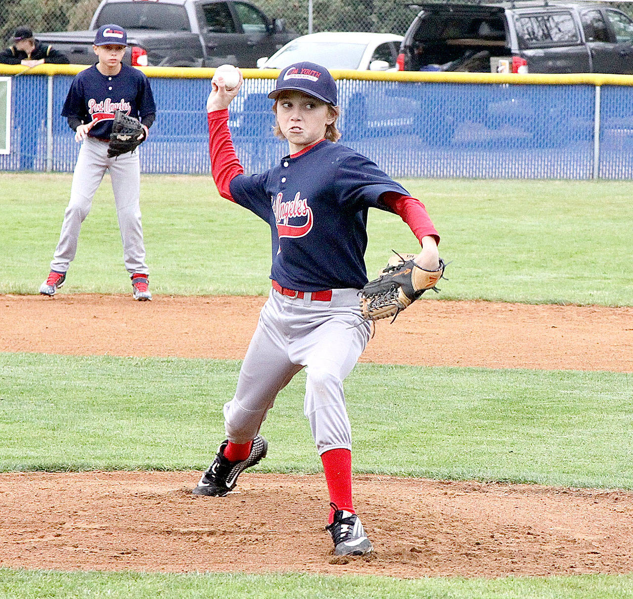 Cameron Colfax of the Port Angeles 12s fires to home plate against the Federal Way Outlaws at the Dick Brown Memorial Baseball Tournament held this weekend at Lincoln Park. He struck out the side. (Dave Logan/for Peninsula Daily News)