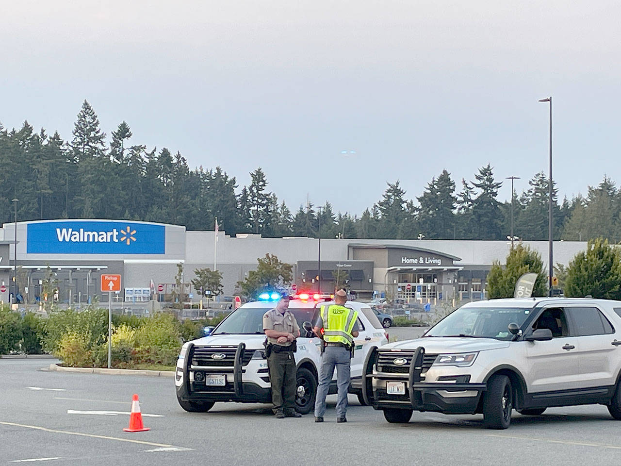 Law enforcement officers block the entrances to the Walmart Supercenter in Port Angeles on Friday evening after a bomb threat was received. (Scott Gardinier/Peninsula Daily News)